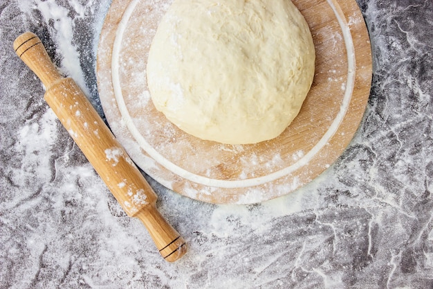 Premium Photo | Dough on a dark background. selective focus.