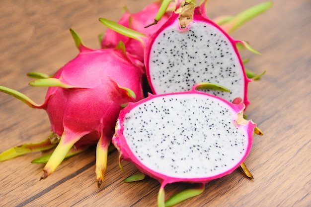 Premium Photo | Dragon fruit slice on wooden background fresh pitaya ...