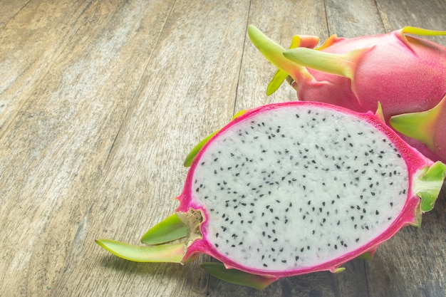 Premium Photo | Dragon fruit on wood table