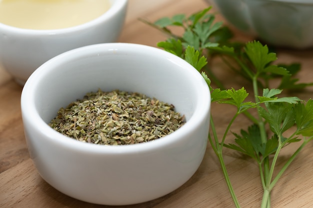 Sage Substitutes - Dried oregano leaves on small bowl