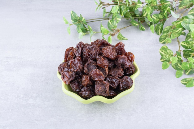 free-photo-dried-sour-cherries-in-a-cup-on-concrete-background-high