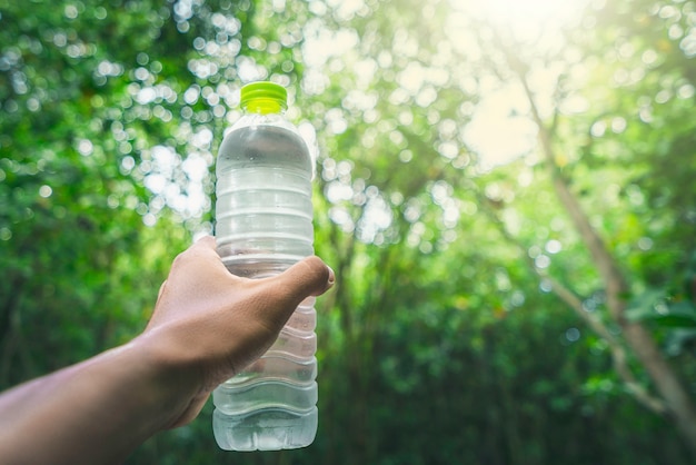 Drinking water and natural green Premium Photo