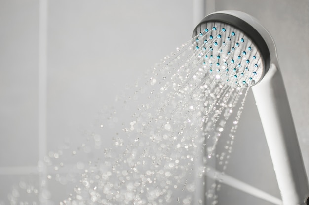 Droplets flowing from shower Premium Photo