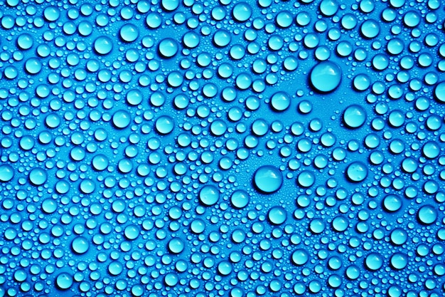 Premium Photo | Drops water on blue background