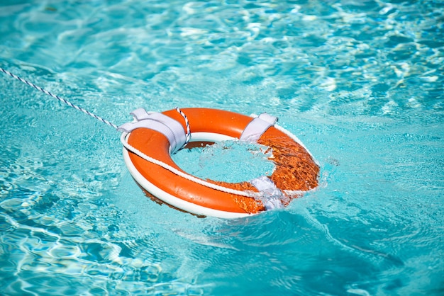 Premium Photo | Drowning in water catch lifebuoy safety and urgent help ...