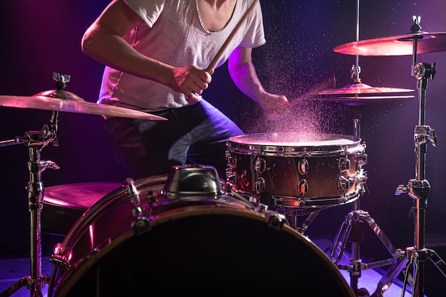 The drummer plays the drums. Free Photo