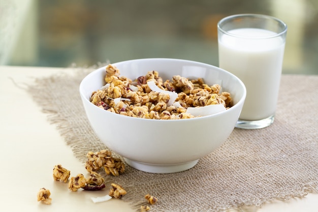 Premium Photo | Dry breakfast cereals. crunchy honey granola bowl with ...