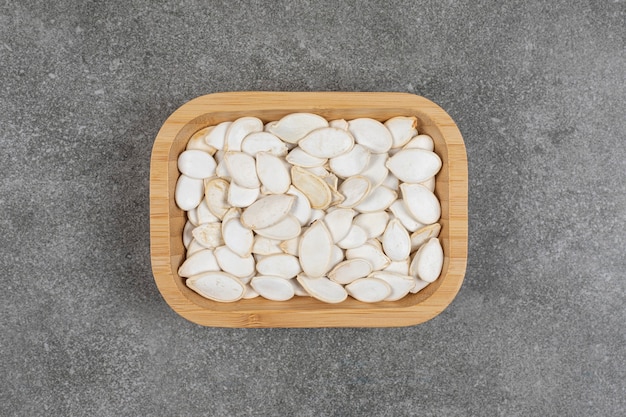 free-photo-dry-pumpkin-seeds-on-wooden-plate