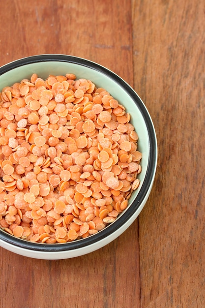 Dry red lentil in bowl Photo | Premium Download