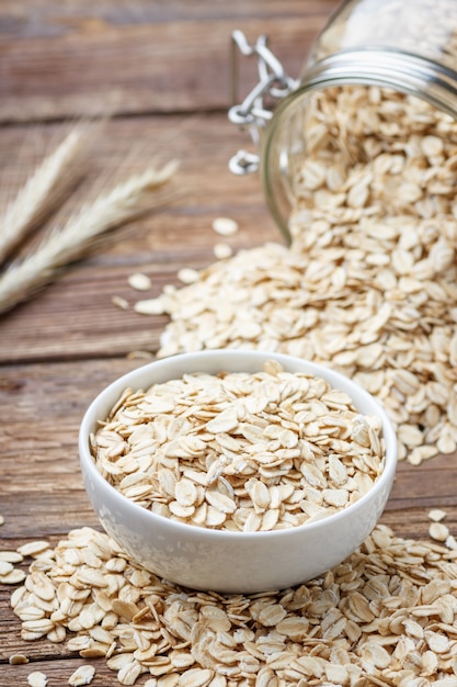 Premium Photo | Dry rolled oat flakes oatmeal