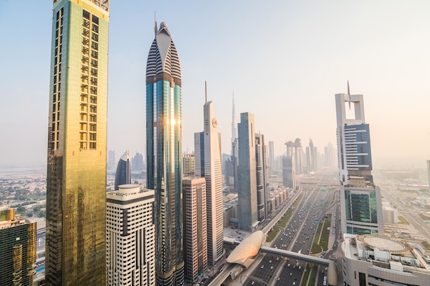 Dubai skyline and downtown skyscrapers on sunset. modern architecture concept with highrise buildings on world famous metropolis in united arab emirates Free Photo