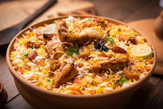 Premium Photo | Dum handi chicken biryani is prepared in an earthen or ...