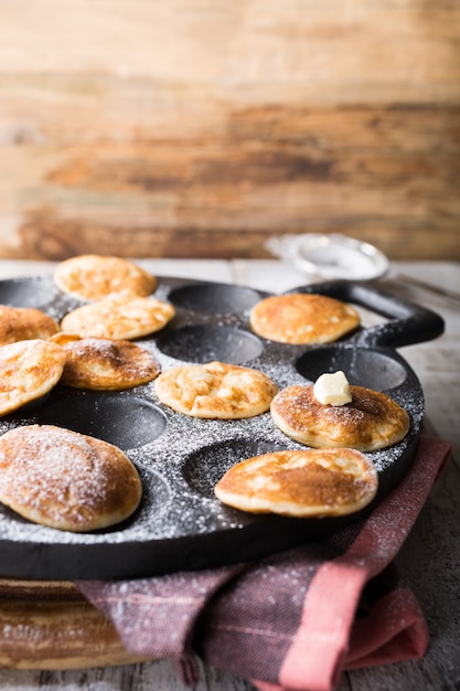 Premium Photo | Dutch mini pancakes called poffertjes