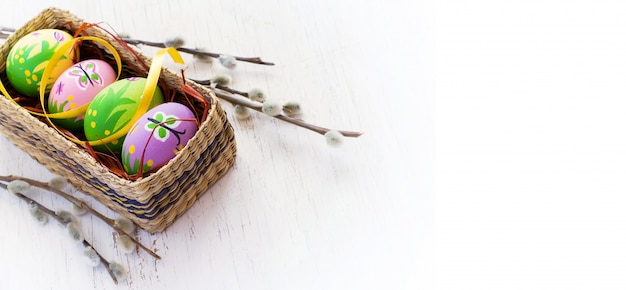 Easter Background With Painted Eggs And Pussy Willow Premium Photo