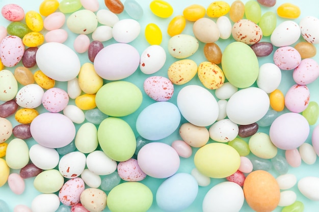 Premium Photo | Easter candy chocolate eggs and jellybean sweets ...