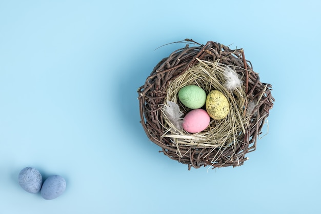 premium-photo-easter-egg-is-a-basket-isolated-on-blue