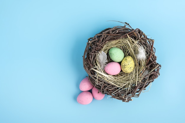 premium-photo-easter-egg-is-a-basket-isolated-on-blue