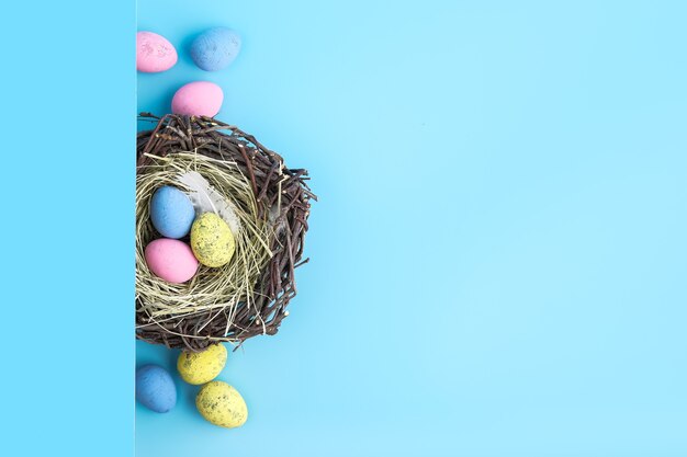premium-photo-easter-egg-is-a-basket-isolated-on-blue