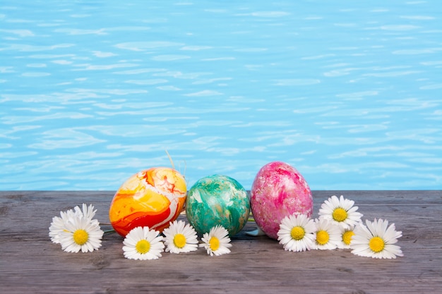 Premium Photo | Easter in pool, wellness and relax. eggs and water ...