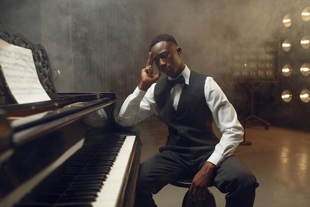 Premium Photo Ebony Grand Piano Player Jazz Performer On The Stage   Ebony Grand Piano Player Jazz Performer Stage With Spotlights Musician Poses Musical Instrument Before Concert 266732 22083 