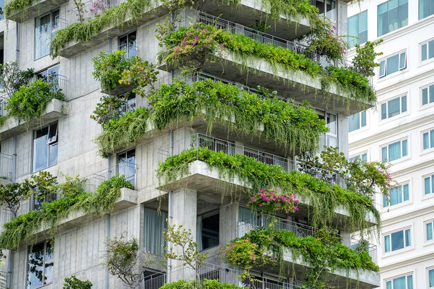 Premium Photo | Ecological buildings facade with green plants and ...