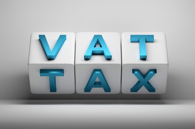 Economy budget word abbreviations vat and tax written on white cubes Premium Photo