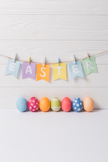 Eggs under easter writing | Free Photo