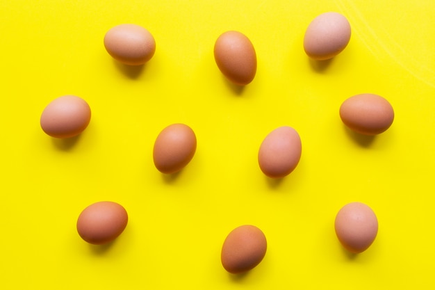 Premium Photo | Eggs on yellow background