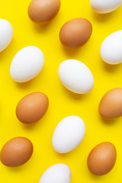 premium-photo-eggs-on-yellow