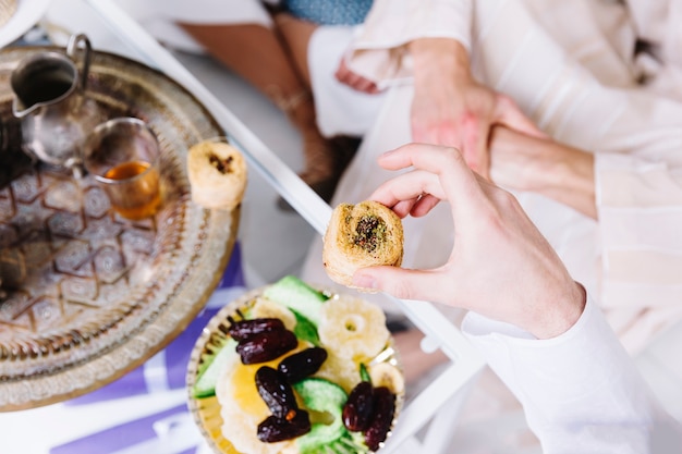 Premium Photo | Eid al-fitr concept with arab food and friends