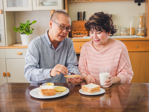 Elder couples are eating breakfast together Premium Photo