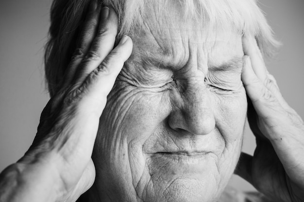Elderly woman suffering from migraine | Free Photo