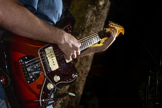 Premium Photo Electric Guitar Player Closeup Photo With Soft Selective Focus