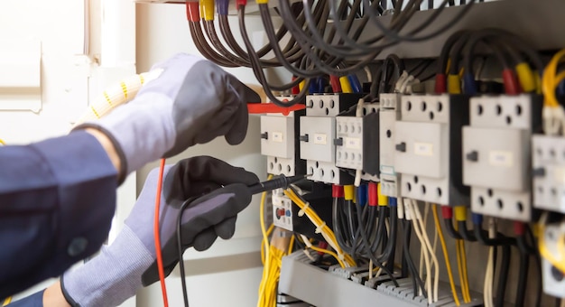 Premium Photo | Electrician engineer tests electrical installations and ...