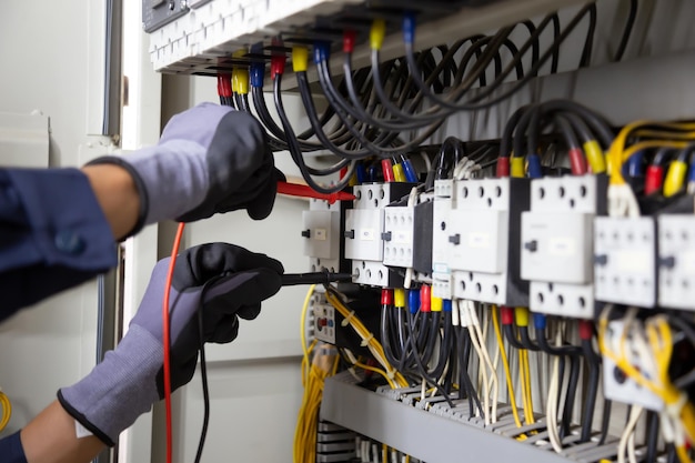 Premium Photo | Electrician engineer tests electrical installations and ...