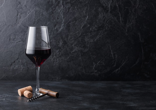 Premium Photo Elegant Glass Of Red Wine With Corks And Corkscrew On