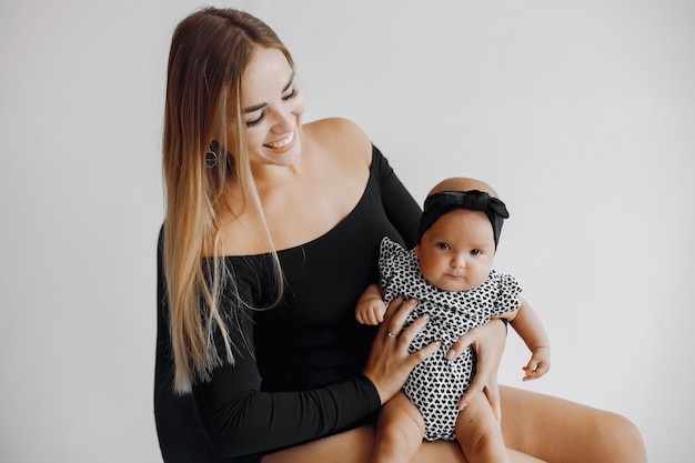 Elegant mother with cute little daughter Free Photo