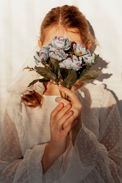 holding flower bouquet