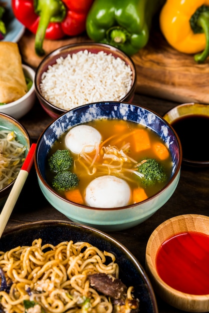 Free Photo | An elevated view of fish ball soup with rice; sauces and ...