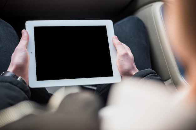 Elevated view of a man using digital tablet with blank screen Free Photo