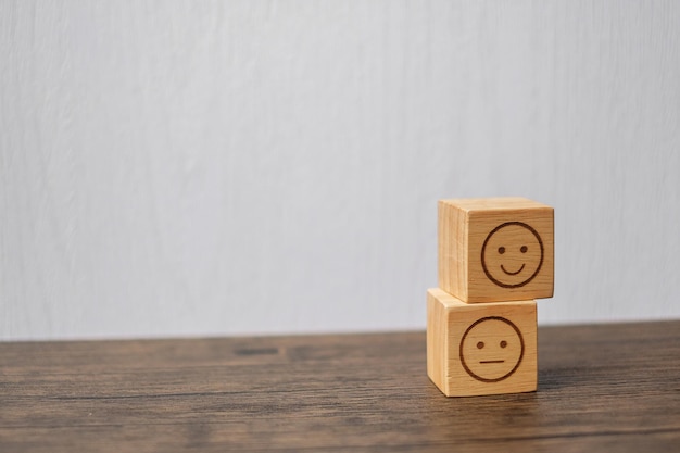 premium-photo-emotion-face-symbol-on-wooden-blocks-mood-service