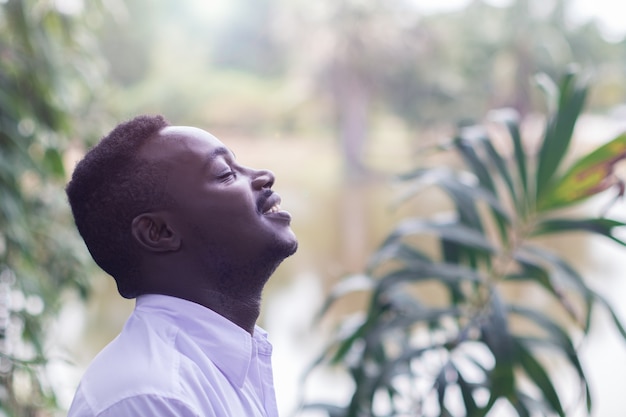 Premium Photo | Emotional african man laughing in wind