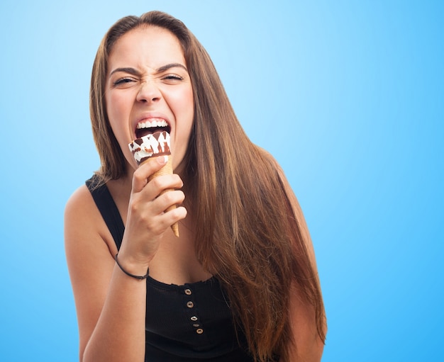 Free Photo | Emotional girl biting ice cream.