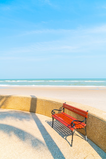 Premium Photo | Empty bench with sea beach background