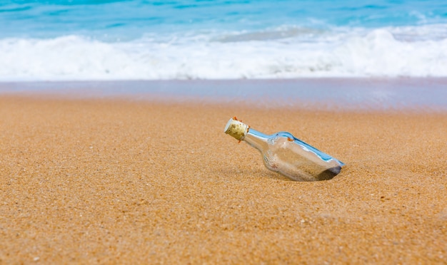 Free Photo | Empty bottle on the shore of the beach