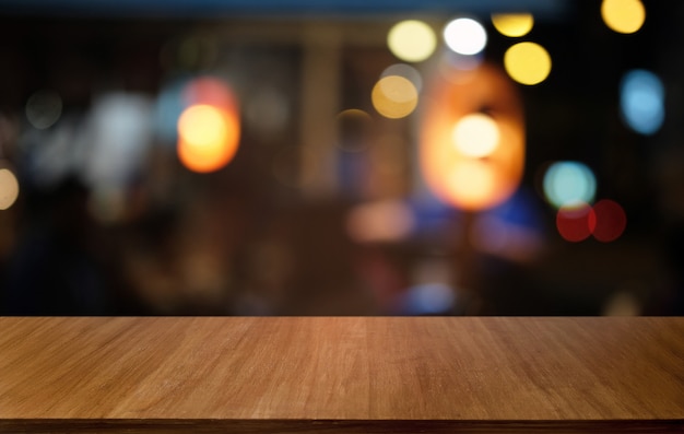 Premium Photo Empty Dark Wooden Table In Front Of Abstract Blurred Bokeh Background Of Restaurant