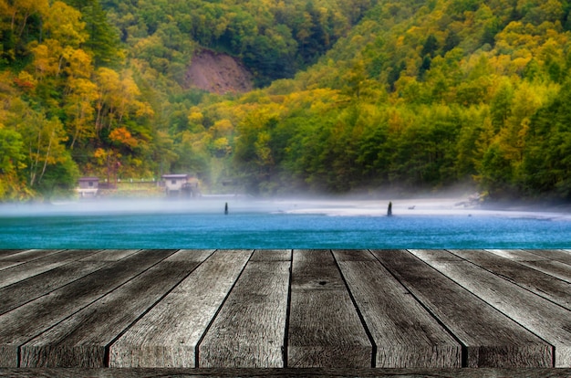 Premium Photo Empty Grey Wooden Table Or Wooden Terrace With Beautiful View Of Taisho Pond At Kamikochi National Park In The Northern Japan Alps