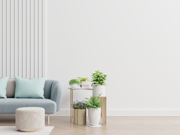 Premium Photo | Empty living room with blue sofa, plants and table on ...