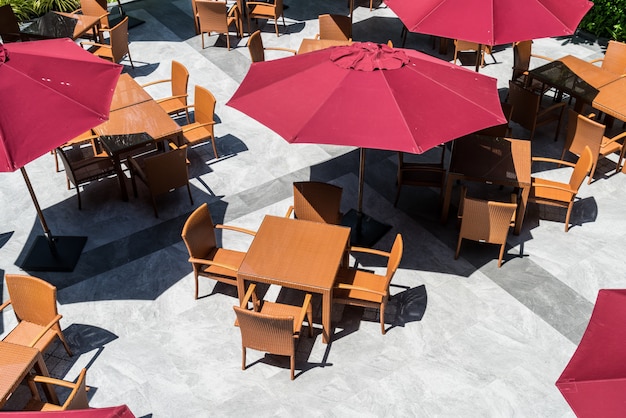 Premium Photo Empty Outdoor Patio Table And Chair With Umbrella