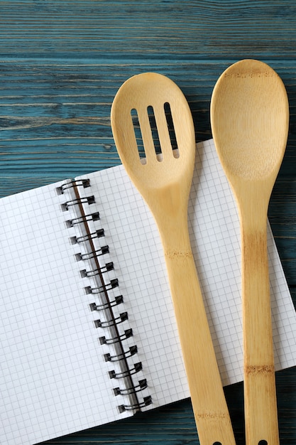 premium-photo-empty-recipe-book-and-utensils-on-wooden-table